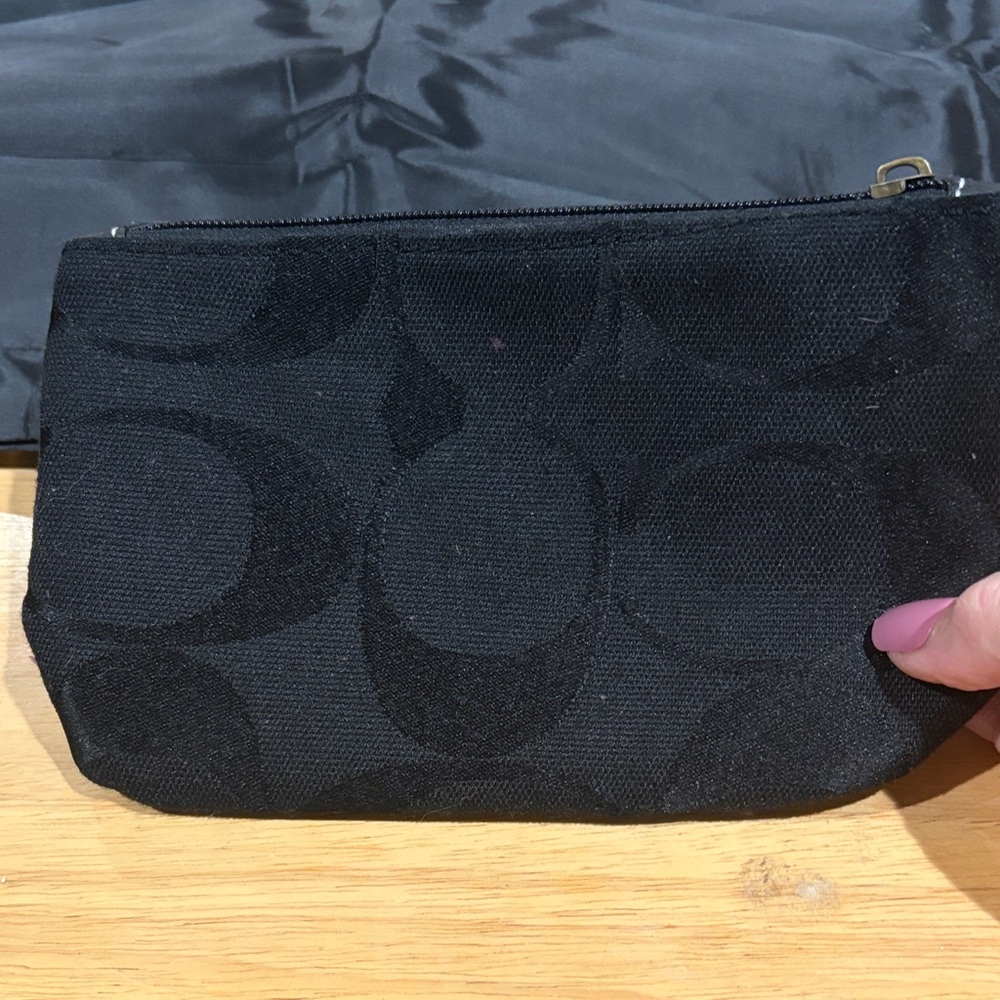 Coach Signature “C” pouch and or wristlet.